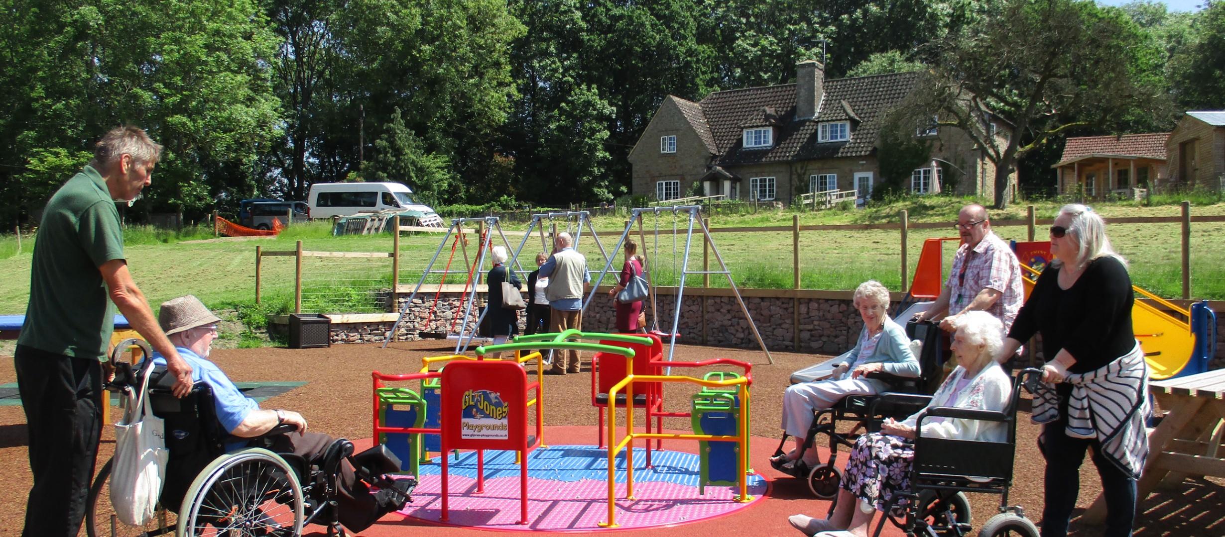 people in wheelchairs enjoying the sun