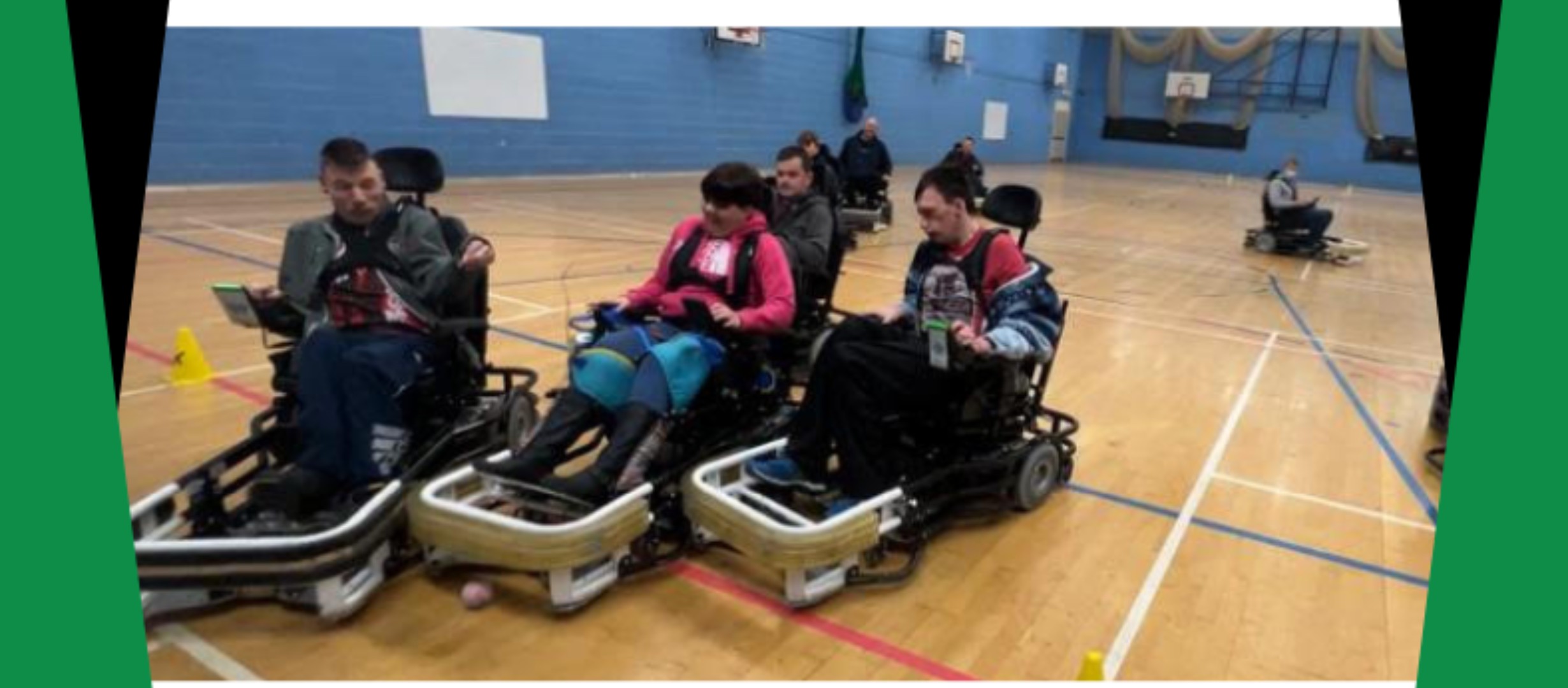 people in powered chairs playing hockey