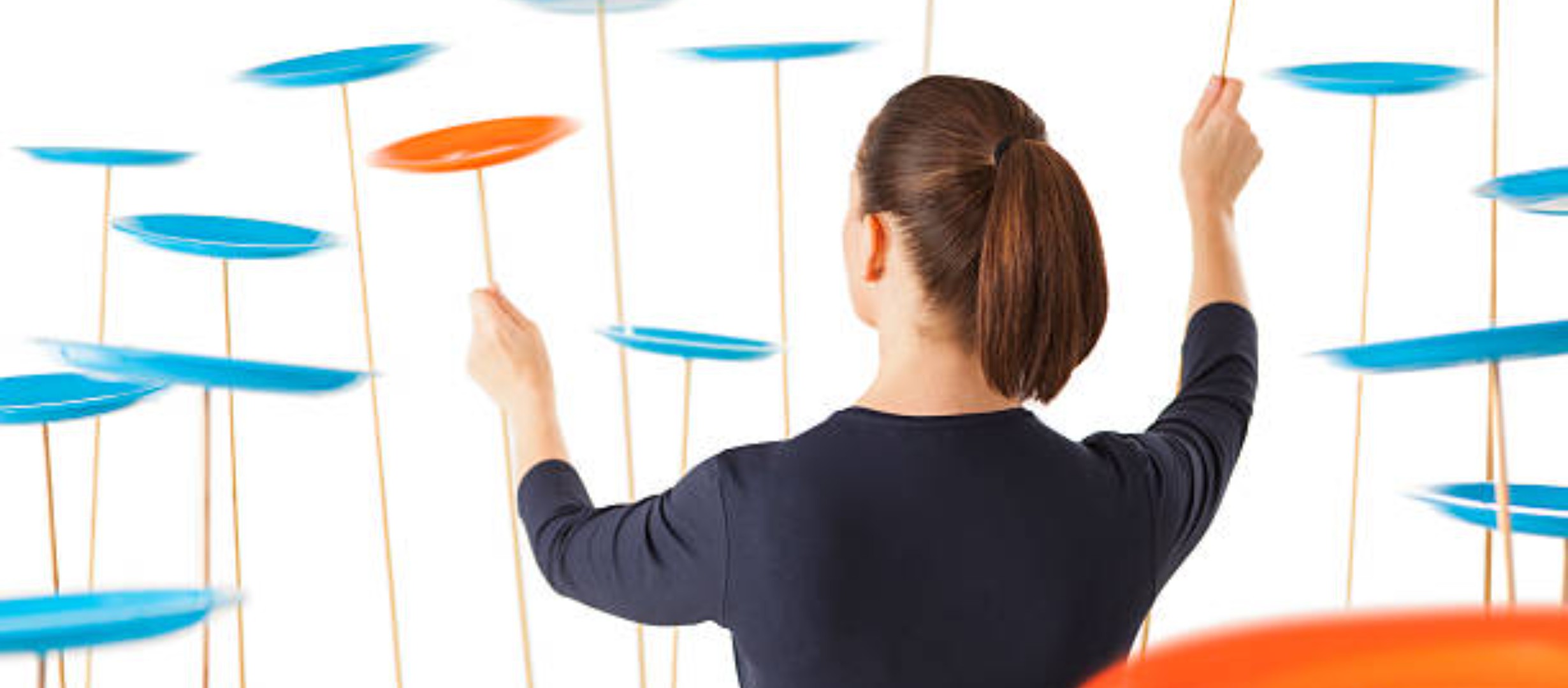 Back of woman spinning plates