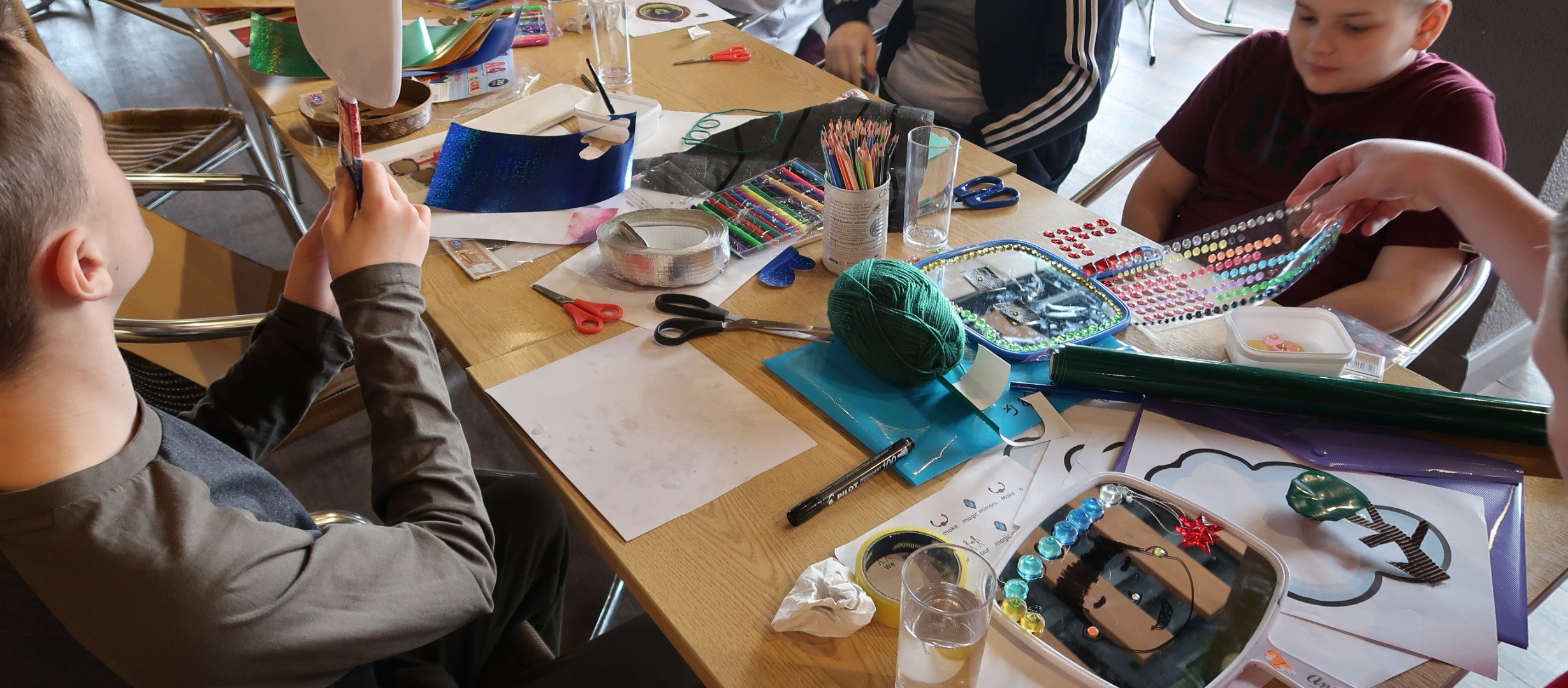 A group of people involved in art and crafts activities
