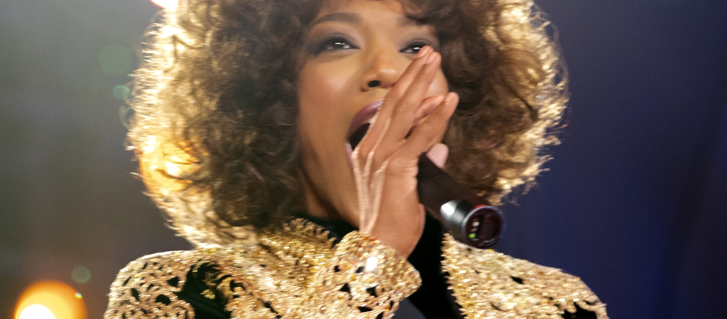Someone singing into a microphone