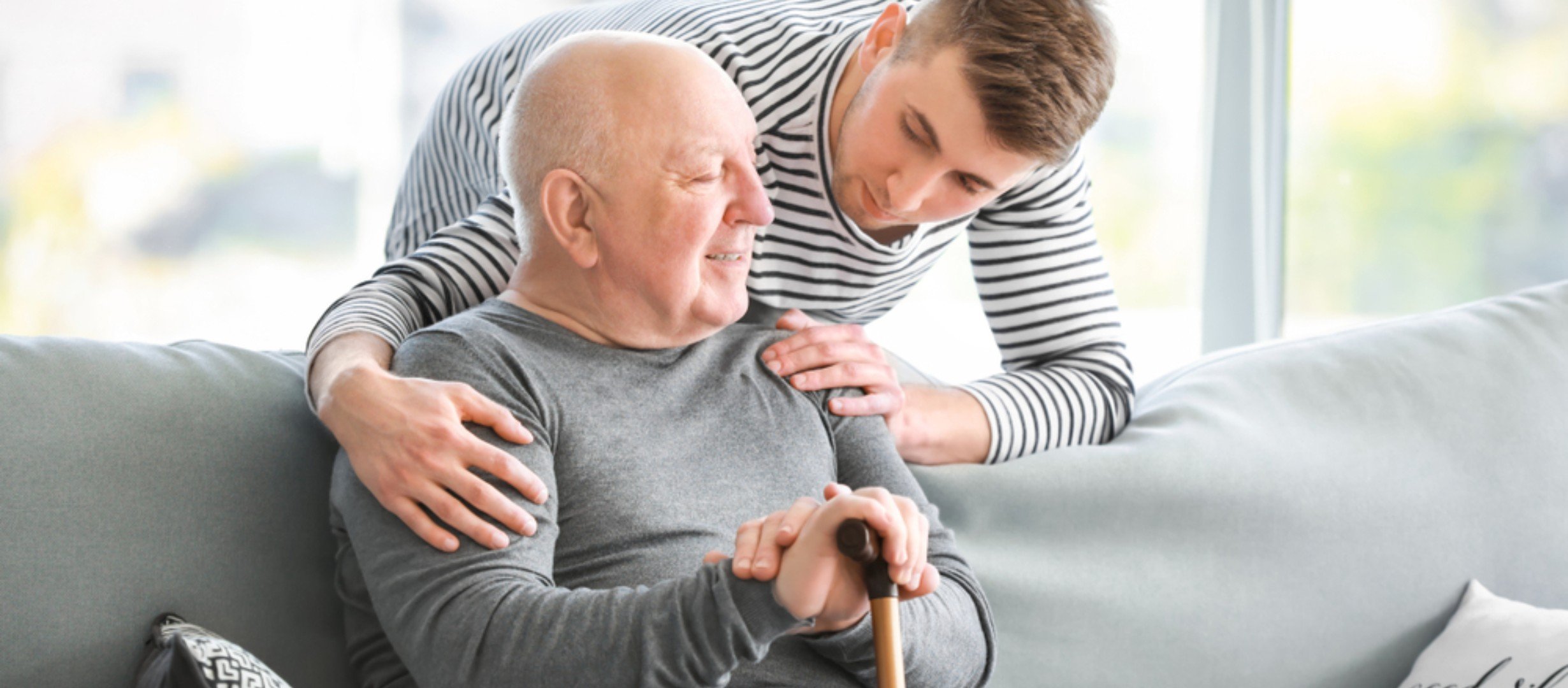 younger and older man talking