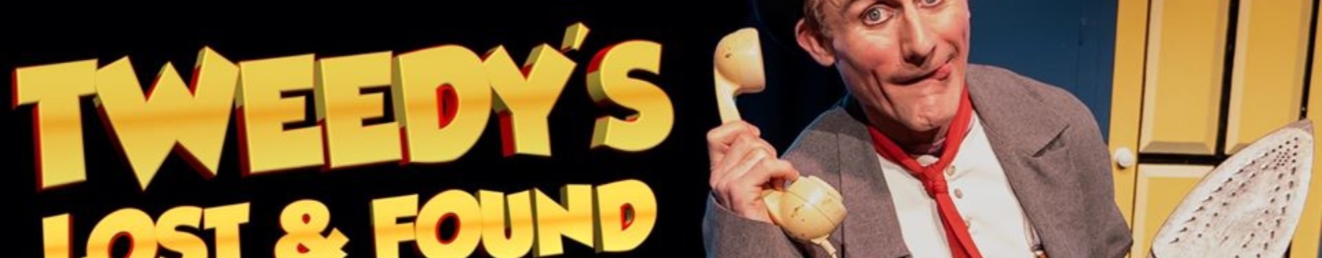 man pulling silly face holding phone and iron