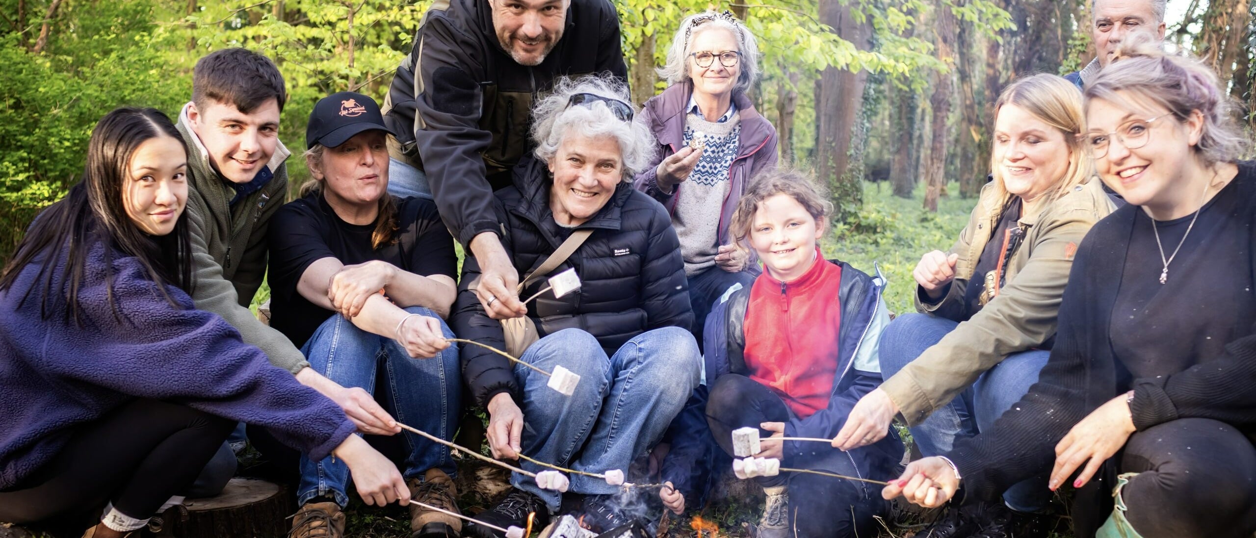 Group of all generations around a campfire