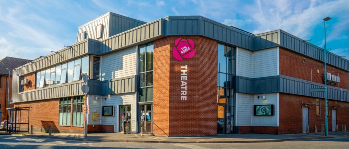 An outside shot of the roses building in bright sunlight with a beautiful blue sky.