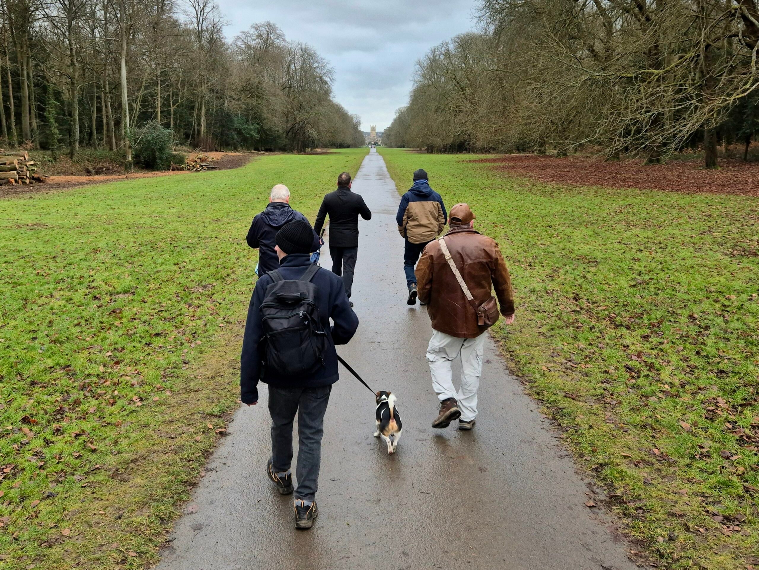 men walking through a park